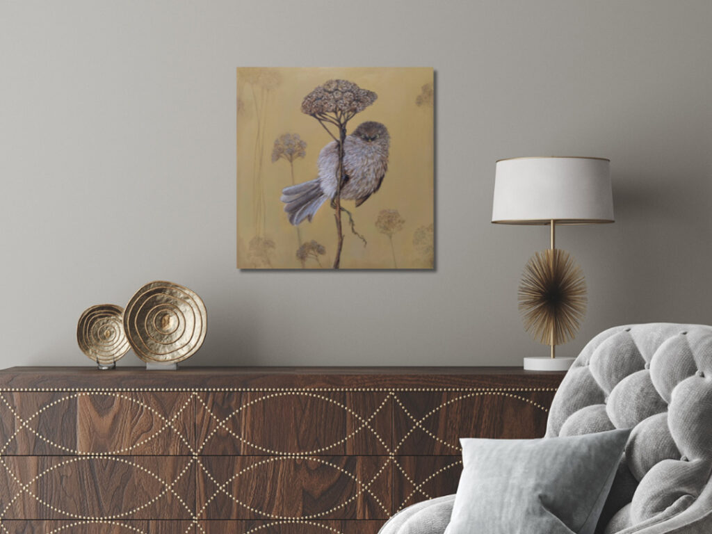 calming bushtit bird artwork with soft yellow background hanging in a neutral living room, creating a gentle, soothing focal point